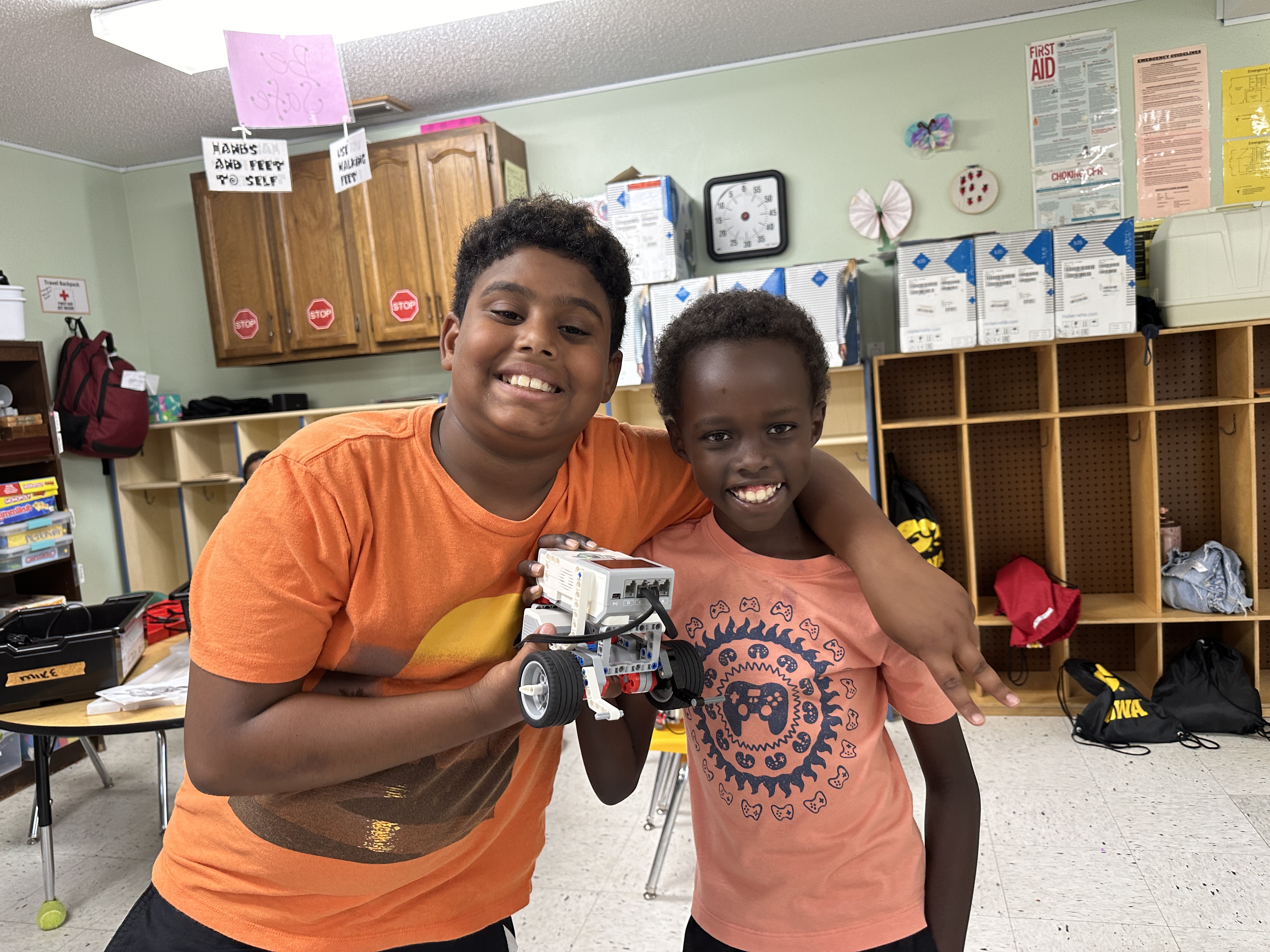 Young people showing a robotics project during YELL